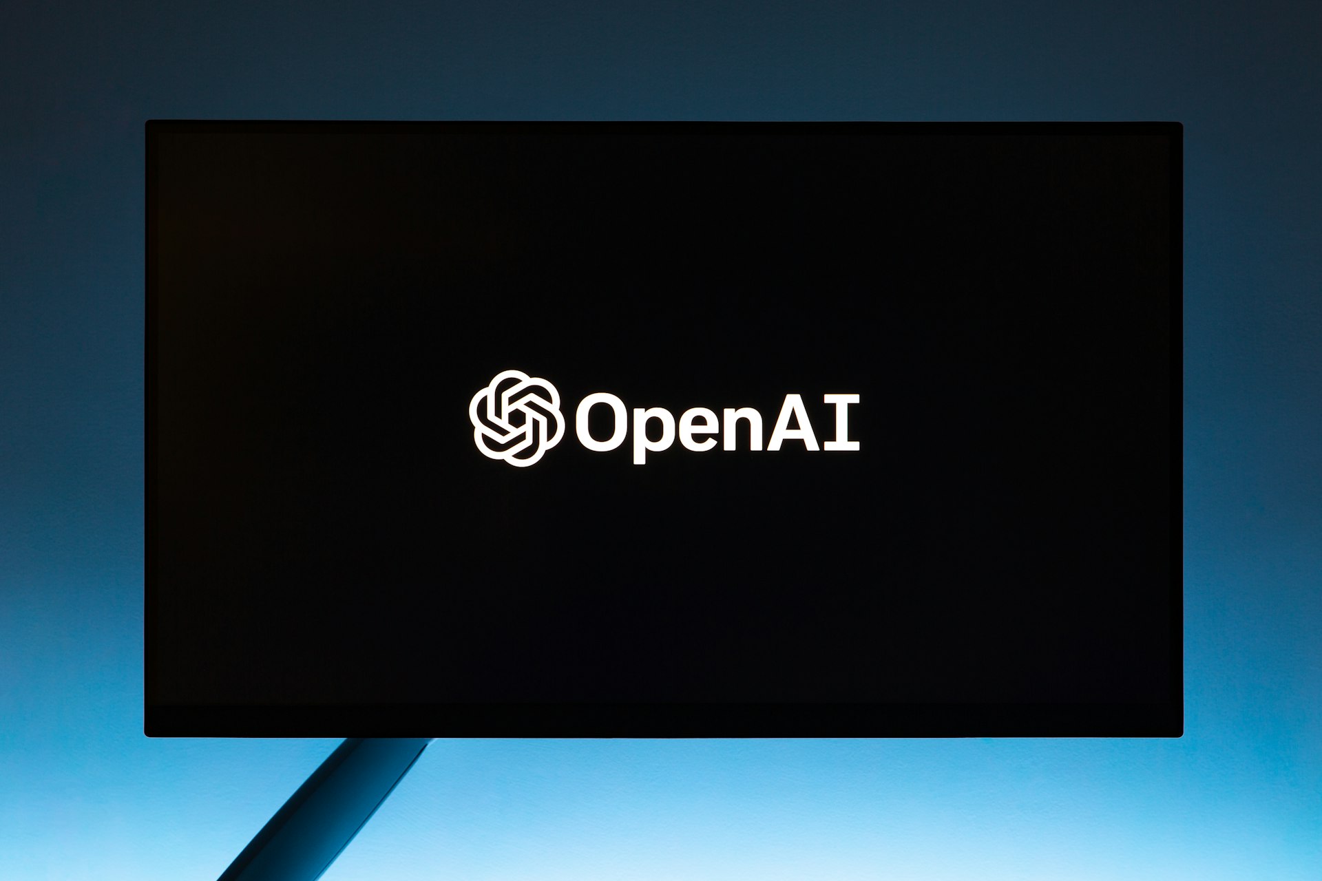 the open ai logo is displayed on a computer screen